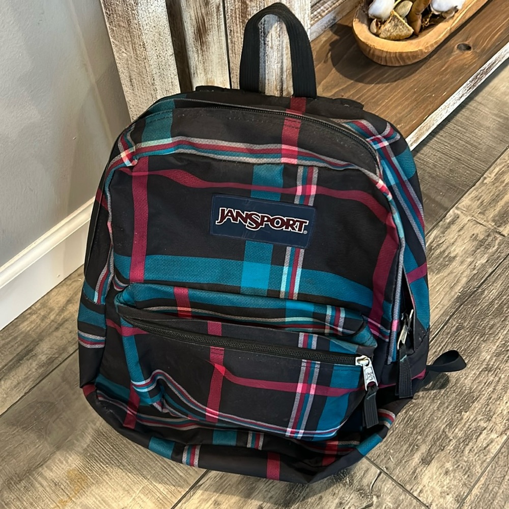 Jansport  with green black and pink  stripes backpack